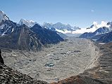 Gokyo 6 Knobby View 4 Kangchung West, Cholatse, Taweche, Kangtega, Thamserku, Kusum Kanguru, Nguzumpa Glacier. Gokyo Kangchung West, Cholatse, Taweche, Kangtega, Thamserku, Kusum Kanguru, and the Nguzumpa Glacier dominate the view to the south from Knobby View north of Gokyo.